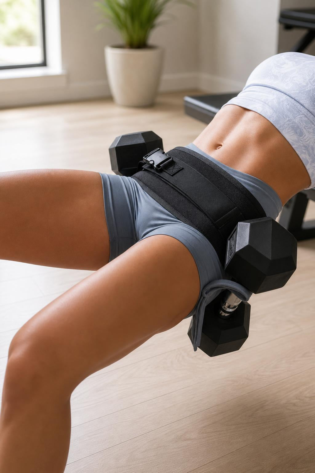 Athlete wearing the weighted waist belt during a hip-thrust exercise
