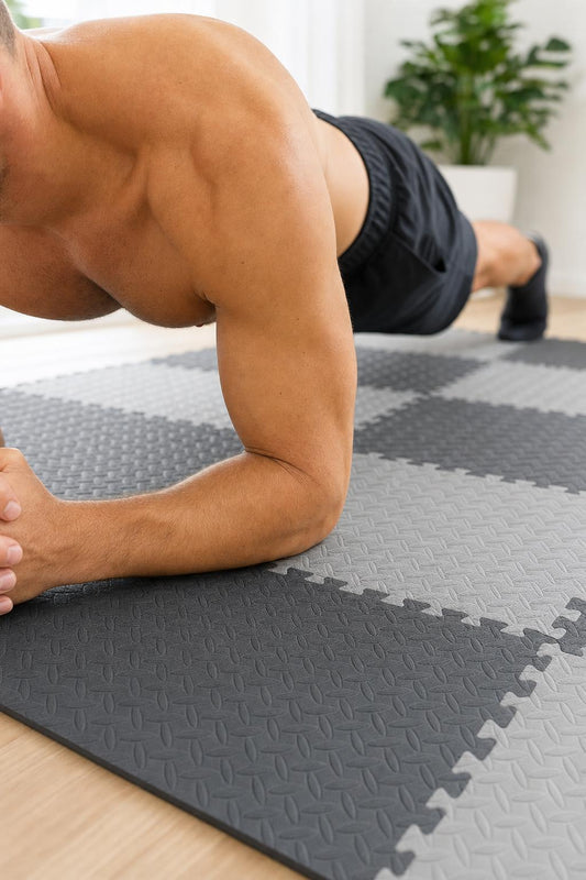 Man doing a plank on the interlocking gym floor mats