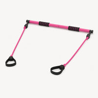 Adjustable Pilates bar with resistance bands, studio shot