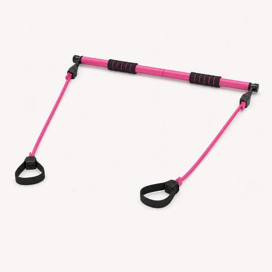 Adjustable Pilates bar with resistance bands, studio shot